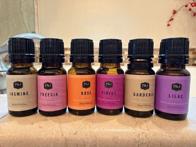 Six fragrance oil bottles: jasmine, freesia, rose, violet, gardenia, lilac