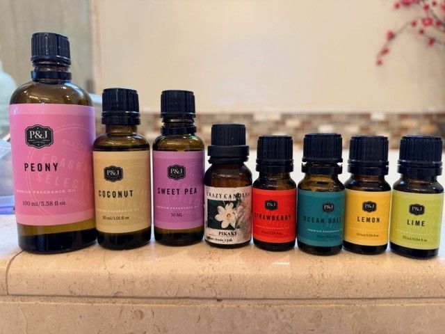 Fragrance oil bottles: peony, coconut, sweet pea, pikake, strawberry, ocean breeze, lemon, lime